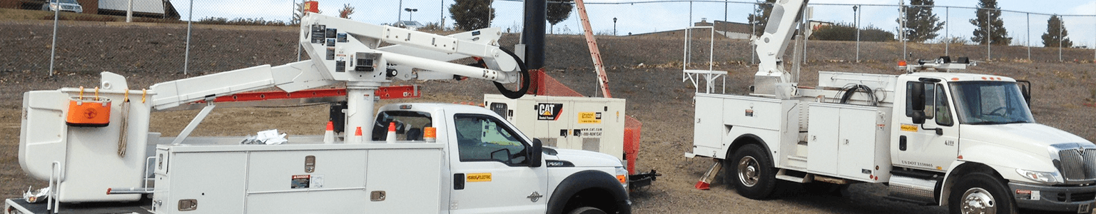 Herron Electric trucks working on a digital sign